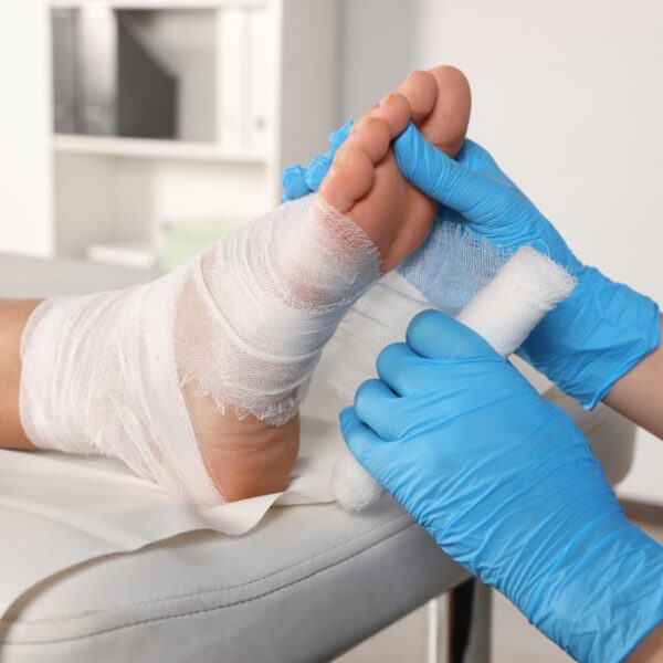 Foot getting wrapped with gauze